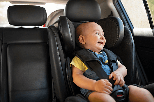 toddler-sitting-in-car